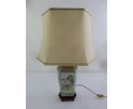 A Chinese octagonal porcelain famile rose table lamp with silk shade