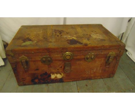 A rectangular steamer trunk with brass locks and hinged cover, A/F