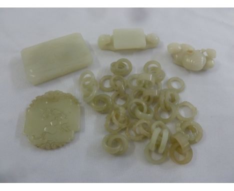 A quantity of jade to include to include stands, plaques and carved rings