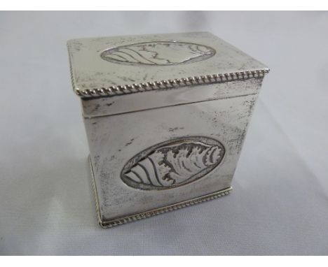 A silver rectangular tea caddy the sides and hinged cover with stylised conch shells and rope twist border, Sheffield 1901