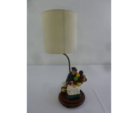 A Royal Doulton figurine of The Old Balloon Seller mounted as a table lamp