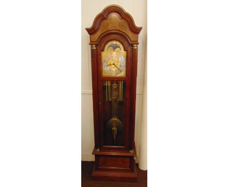 A mahogany striking long case clock by Westwood, the arched top, glazed hinged door, silvered with Arabic numerals and moon p