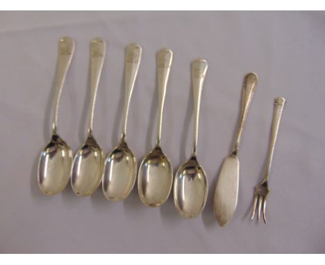A quantity of silver flatware to include five teaspoons, a butter knife and a pickle fork