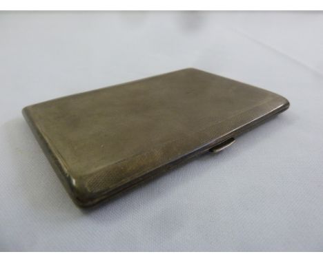 A silver engine turned rectangular cigarette case