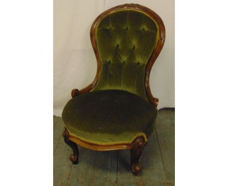 A Victorian button back ladies chair on scroll legs