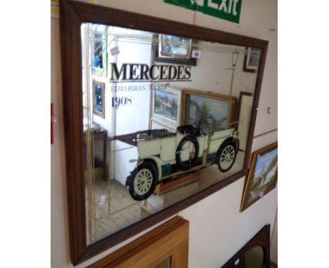 A stained wood framed reproduction Mercedes advertising wall mirror featuring a 1908 Edwardian Tourer