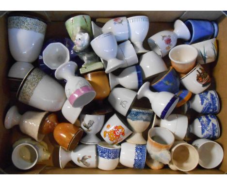 A box containing a quantity of vintage and other ceramic egg cups