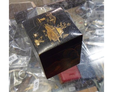 A 1920's chinoiserie lacquer decorated playing card box with two miniature playing card sets inside