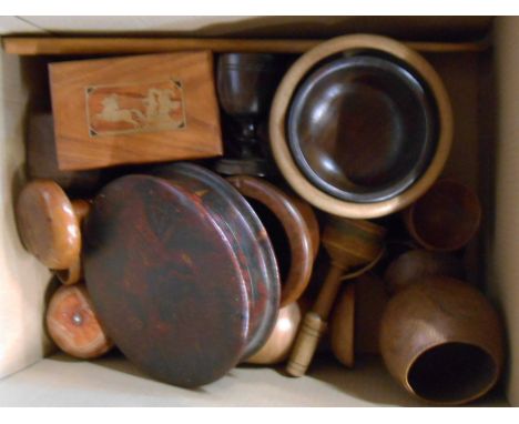 A box containing quantity of treen items including Russian brass inlaid box, lacquered box, nutcracker, etc.