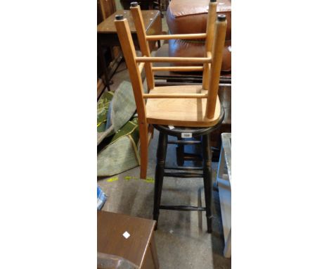 An old stained wood bar stool with ring turned supports - sold with a vintage child's school chair