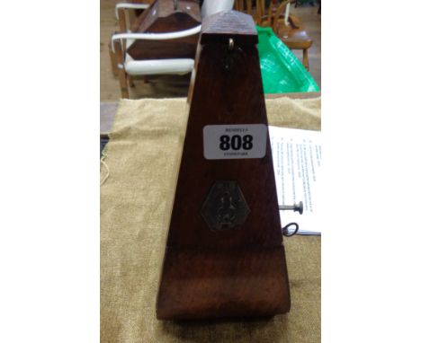 An old wooden cased metronome
