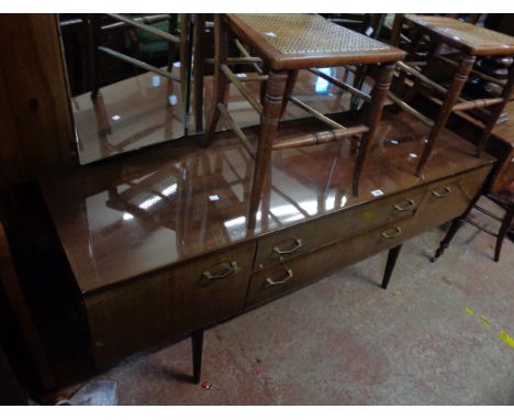 A 1.58m retro polished mixed wood dressing chest with triple mirror, two central drawers and flanking cupboards, set on mould