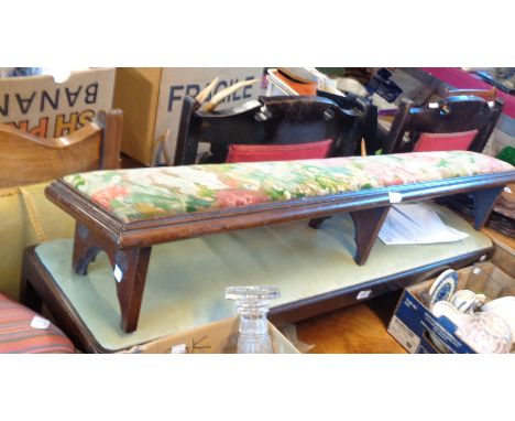 A 1.2m stained wood long foot stool with upholstered top, set on chamfered square supports - sold with a late Victorian kneel