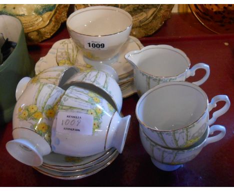 A Gladstone china Art Deco part tea service comprising six trios, milk and sugar and bread and butter plate