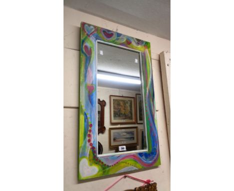 A decorative painted wood framed oblong wall mirror with heart decoration