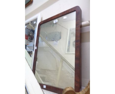 An antique mahogany framed wall mirror with rounded corners and oblong plate - from a dressing table