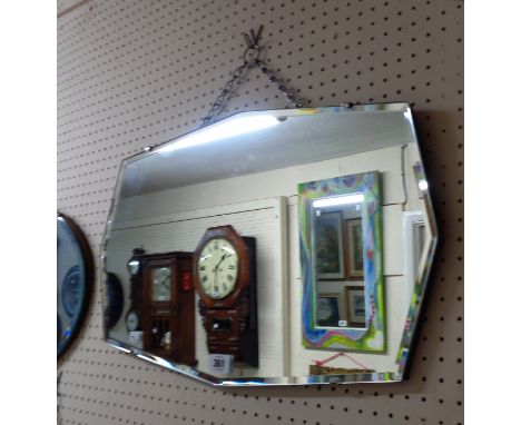 A vintage frameless bevelled octagonal wall mirror