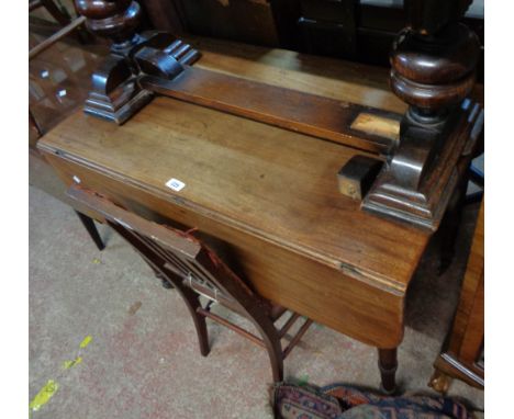 A 93cm 19th Century mahogany Pembroke table with drawer to one end and opposing dummy drawer front, set on ring turned legs w