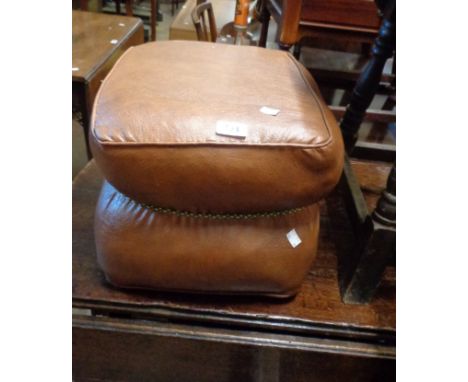 A vintage brown leatherette upholstered pouffe with central cord binding