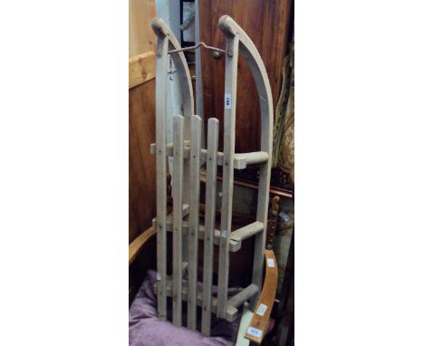 A vintage wood and wrought iron sled - a/f