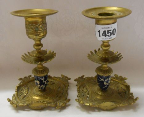 A pair of Victorian cast brass decorative candlesticks with pierced feet, ceramic stem and removable sconces - registration d