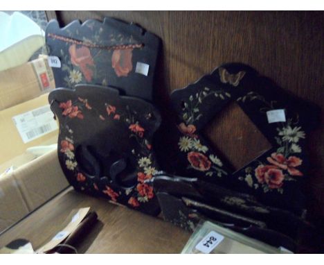 A Victorian papier mache wall hanging magazine rack - sold with a wall pocket with inset mirror and another wall bracket