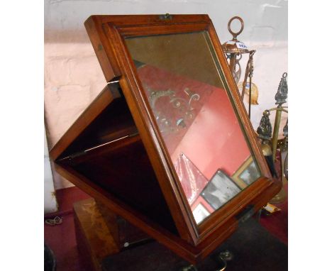 A Victorian mahogany campaign style travelling mirror with folding ratchet action