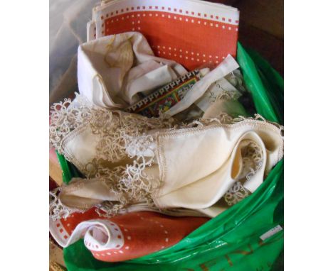 A bag containing a small quantity of textiles including crochet work tray cloths, etc.