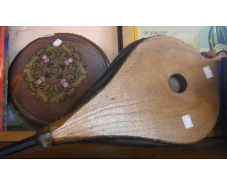 An old small stool with beaded tapestry top - sold with a pair of antique wooden bellows