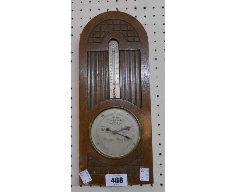 A small oak cased wall barometer/thermometer with aneroid works, dial marked for Short &amp; Mason