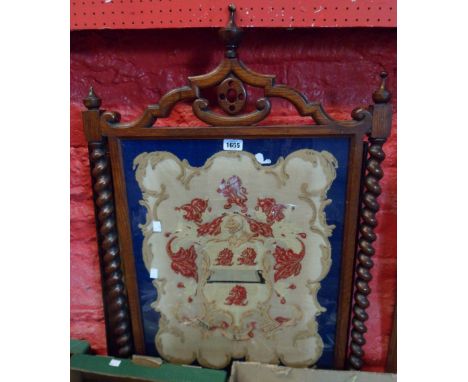 A 19th Century oak firescreen panel with heraldic tapestry panel under glass - sold with a framed needle work picture, depict