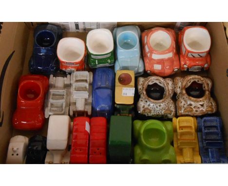 A box containing a quantity of ceramic novelty car items including egg cups, cruets, etc.