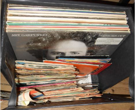 A record case containing a quantity of LP and 45 records including David Bowie, Art Garfunkel, etc.