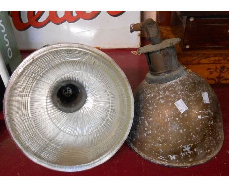 Two early 20th Century holophane lamps with textured glass shades contained within original metal casing and light fittings -