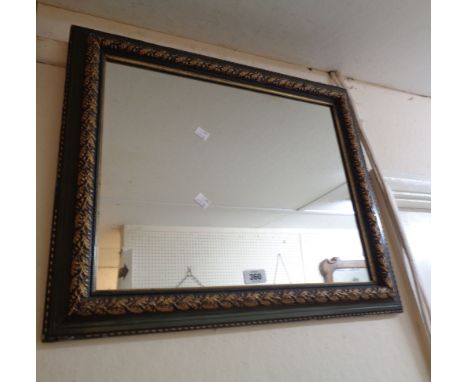 A decorative green painted and parcel gilt framed oblong wall mirror with oak leaf and acorn decoration