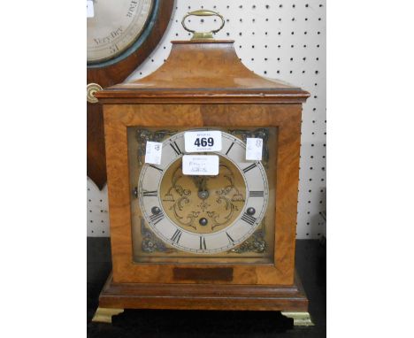 A figured walnut cased bracket style table clock with decorative dial and Mappin &amp; Webb, London eight day chiming movemen