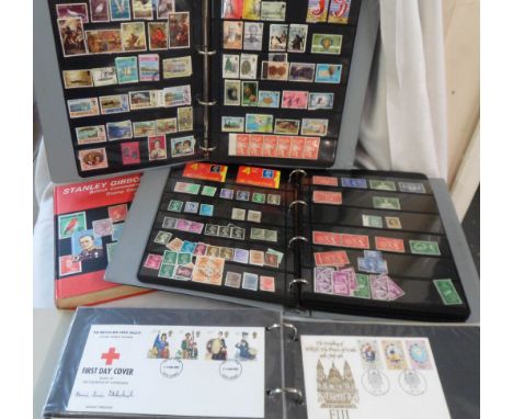 A blue ring bound stock album containing a collection of Victorian and later GB stamps including two close margin Penny Black