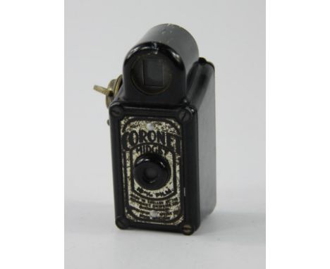 A Coronet Midget camera, 7cm high.