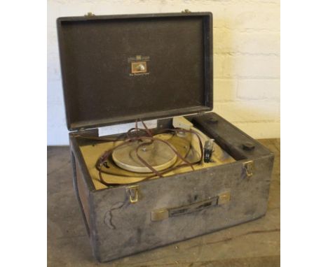 A mid 20thC HMV table top record player, the rectangular case hinging to reveal an articulated interior with arm and 17cm dia