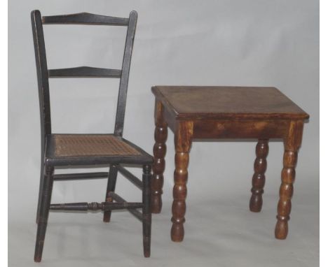 Two small items of furniture, comprising an oak side table with bobbin turned legs, and an ebonised and rush seated child's c