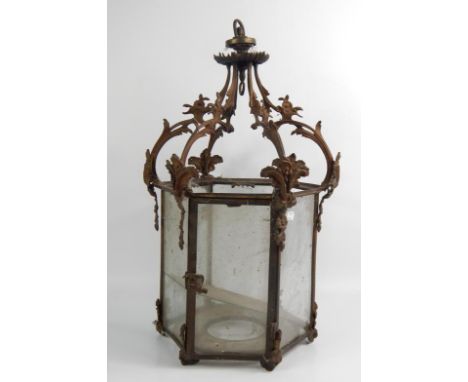 A Victorian foliate cast iron and clear glass hexagonal hall lantern, 58cm x 35cm.