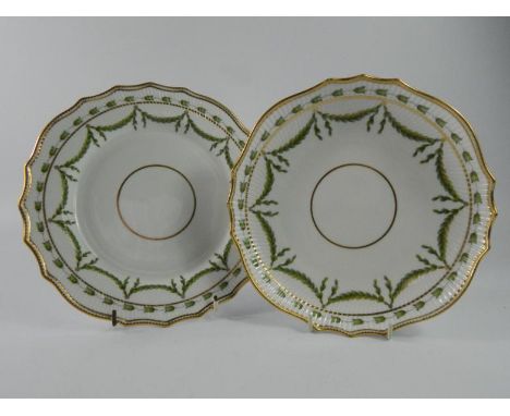 Two items of Copeland Spode, from Wigmores London, plates decorated with green leaves and picked out in gilt, 22cm diameter.