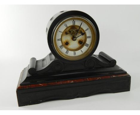 A late 19thC French black slate and marble drum shaped mantel clock, with a white enamel dial, Roman numerals, visible brocot