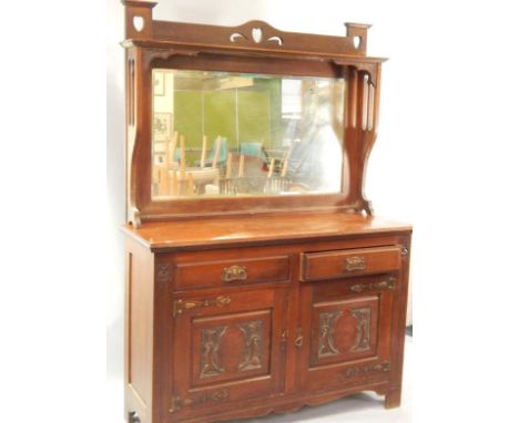 A Victorian mahogany mirror back sideboard, with carved and pierced decoration, and brass Art Nouveau handles and hinges, wit