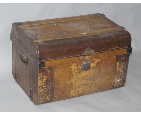 An early 20thC tin trunk, 48cm high, 70cm wide, 50cm deep.