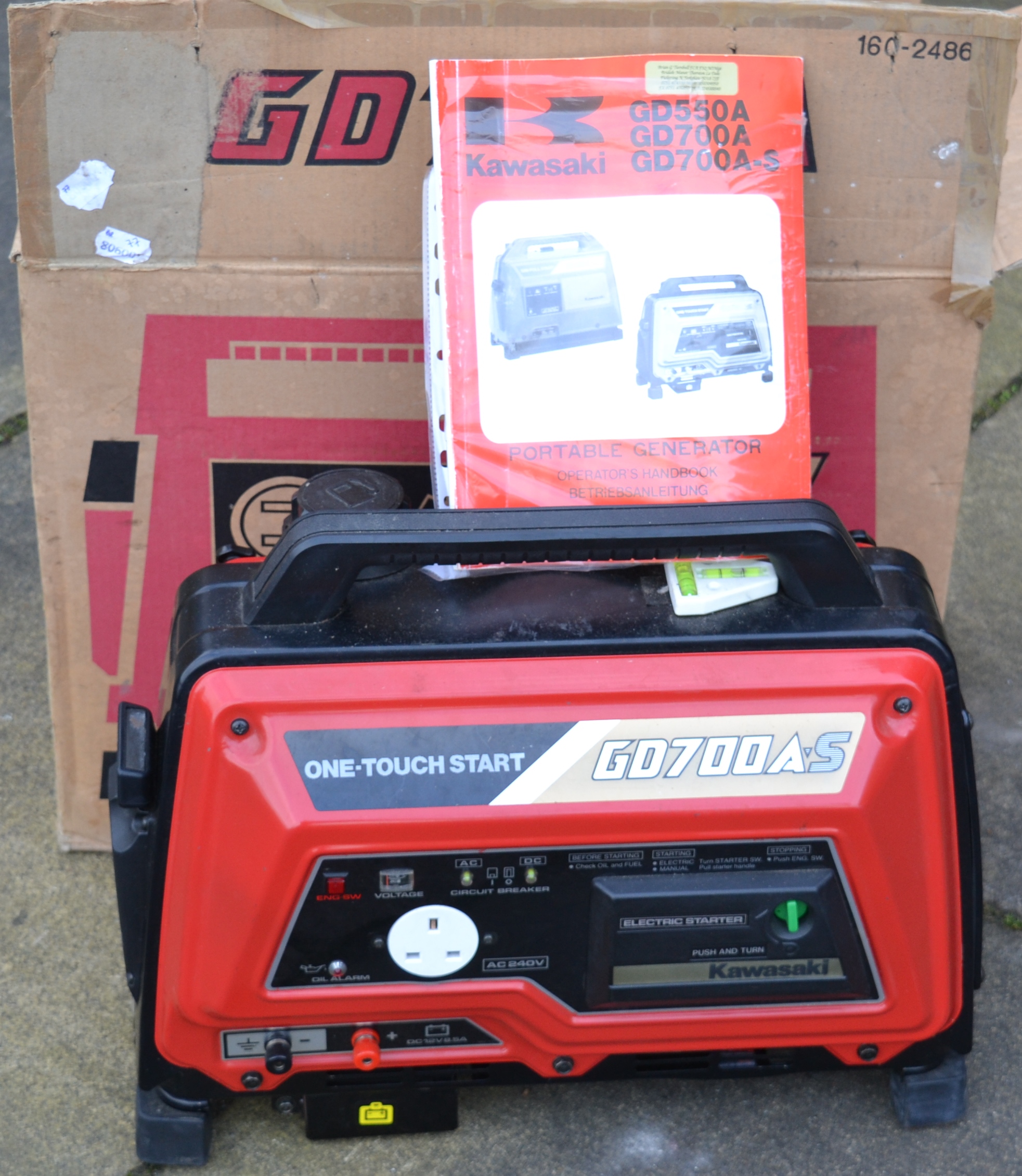 A Kawasaki GD700A petrol / electric one touch start electric generator