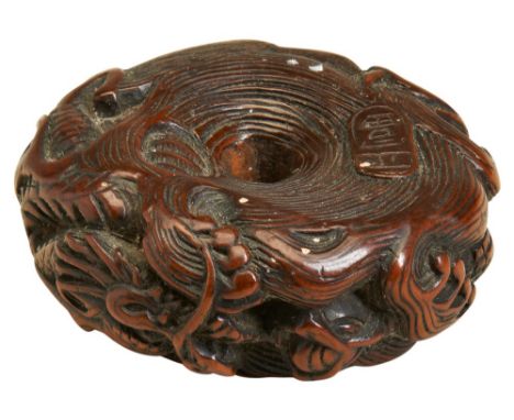 A FINE JAPANESE CARVED WOOD NETSUKE BY MASATOMI EDO PERIOD, 18TH CENTURY modelled as a coiled dragon, signed 6cm diam 