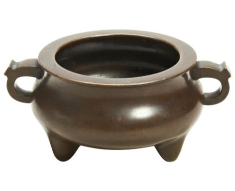 A BRONZE TRIPOD CENSER XUANDE SEAL MARK, 17TH / 18TH CENTURY of compressed globular form raised on three low conical feet, th