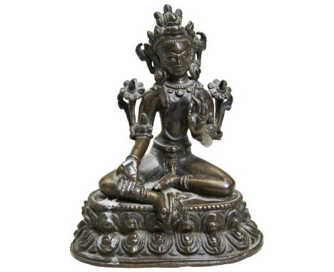 A BRONZE FIGURE OF GREEN TARA TIBET, 15TH / 16TH CENTURY seated in&nbsp;lalitasana&nbsp;on a double-lotus base,&nbsp;with her
