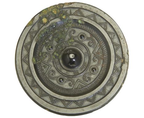 A SMALL BRONZE MIRROR HAN DYNASTY (202BC - AD220) decorated with stylised bands 8cm diam  PROVENANCE: From a Private Hong Kon